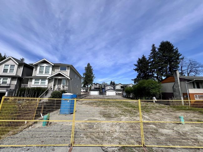 View of yard with fence and a residential view | Image 4