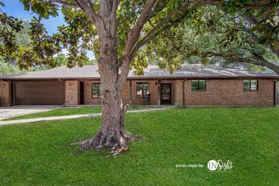 Single story home with a garage and a front lawn*virtual grass* | Image 1