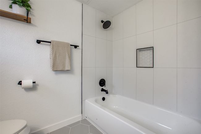 Full bath with tile patterned flooring and tub / shower combination | Image 16