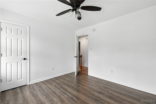 Another view of 2nd bedroom featuring Laminate-style floors and ceiling fan | Image 22