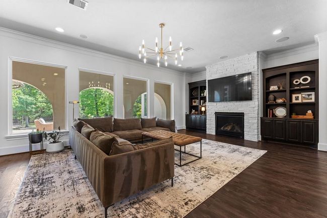 Another view of the family room, with views of the backyard oasis! | Image 9
