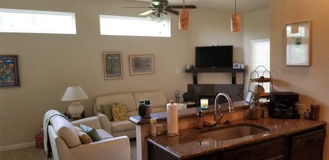 Cozy and perfect for entertaining! Walk out to your deck from this living room | Image 4