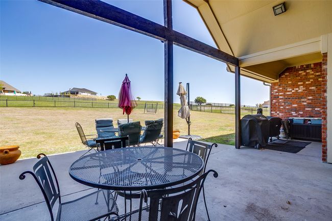 View of patio / terrace featuring outdoor dining area, fence, and area for grilling | Image 26