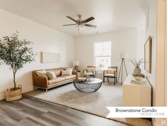 Living area featuring visible vents, baseboards, wood finished floors, and ceiling fan | Image 7