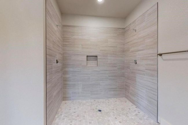 Full bathroom featuring a tile shower | Image 22