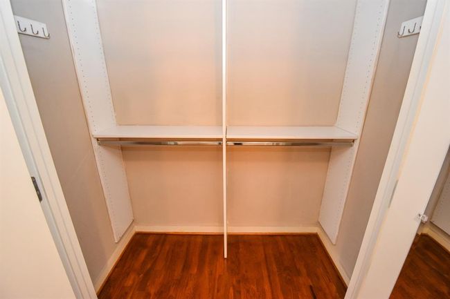 This photo features a separate small closet in the open-concept loft, perfect for additional storage. | Image 32