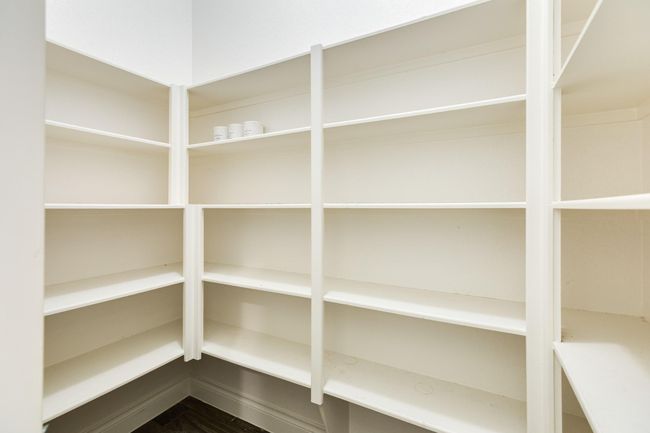 The walk in pantry has more than enough room for all your food storage needs. | Image 22