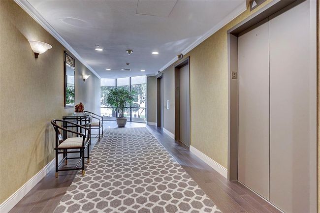 Each hallway is beautifully appointed and features 3 elevators for convenience. | Image 33