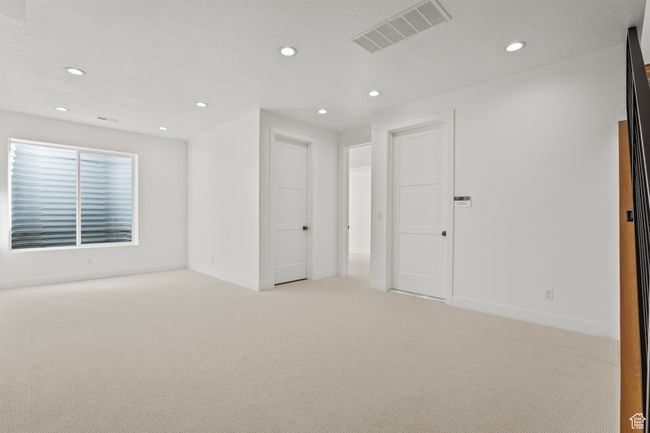 Carpeted spare room featuring recessed lighting and a textured ceiling | Image 51