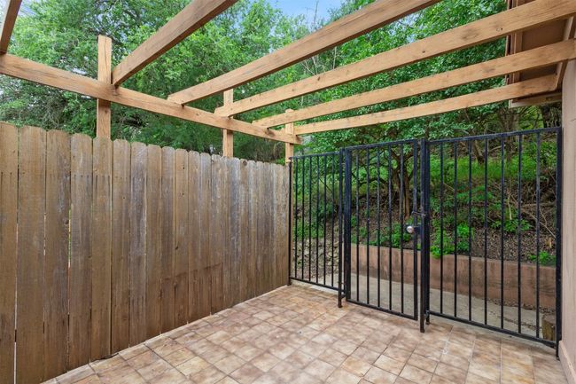 Patio/terrace featuring fence and security gate | Image 18