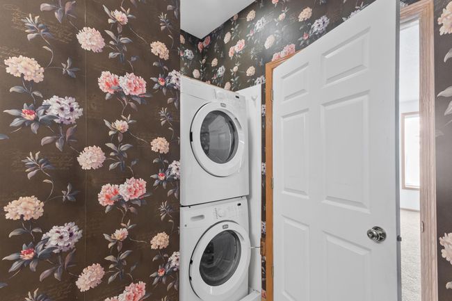 Stacked washer & dryer for your convenience in the primary ensuite. | Image 15