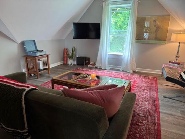 Living room featuring vaulted ceiling and wood finished floors | Image 30
