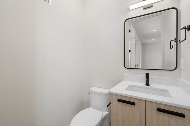 Bathroom featuring toilet and vanity | Image 26