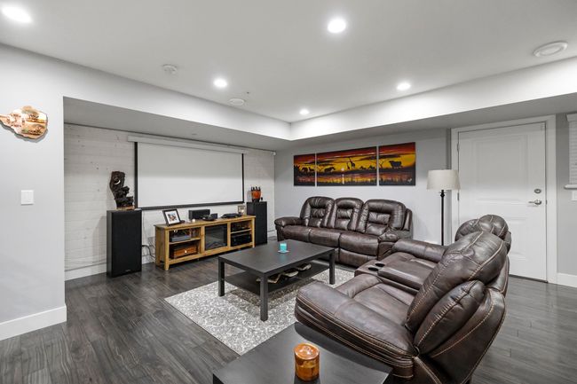 Home theater featuring recessed lighting, dark wood-style flooring, and baseboards | Image 30