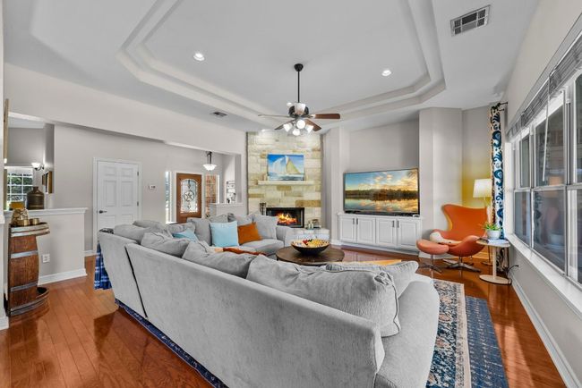 Throughout the home, you'll find elegant details like tray ceilings and all hard-surface flooring, including both hardwood and tile | Image 6