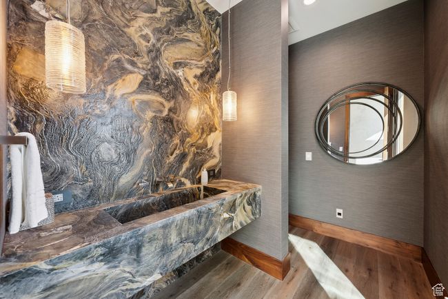 Bathroom featuring wood finished floors and baseboards | Image 34