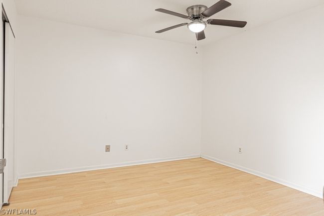 Unfurnished room featuring ceiling fan and light hardwood / wood-style floors | Image 26