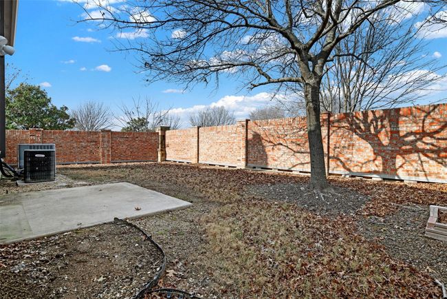 Fenced backyard with central AC and a patio | Image 34