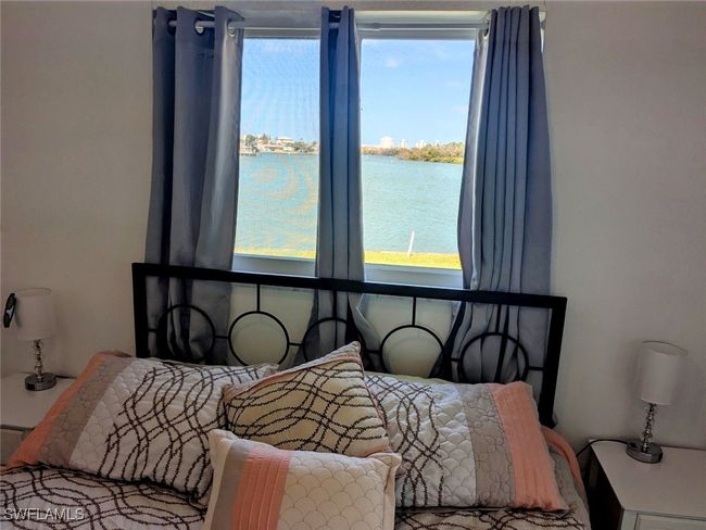 Bedroom with a water view | Image 32