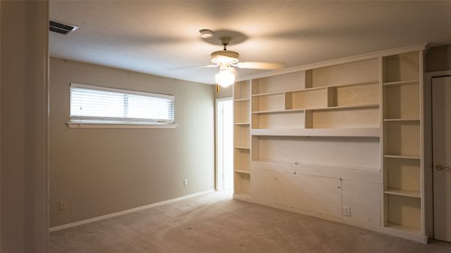 Unfurnished bedroom with visible vents, baseboards, a closet, ceiling fan, and light carpet | Image 29