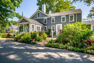 Garden entrance amongst container garden with sunroom | Image 2