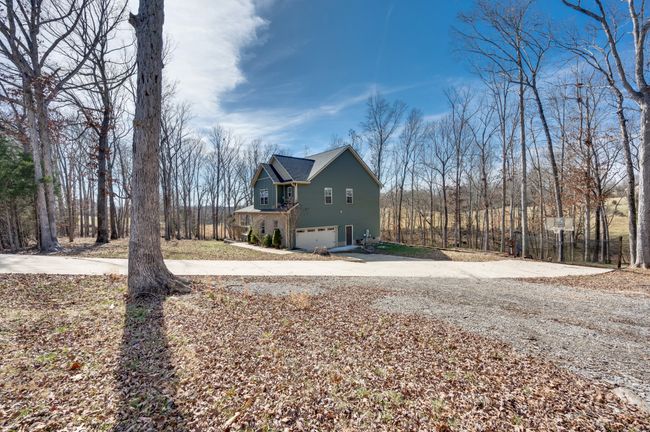 View from the secondary garage drive looking back towards the home. | Image 10