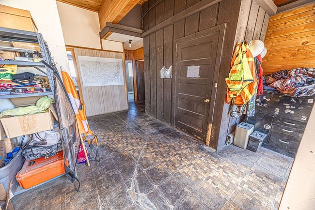 Bathroom featuring wood walls and tile patterned floors | Image 50
