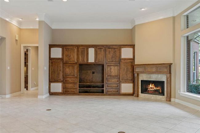 Another view of the living room - great fireplace and built ins. | Image 9