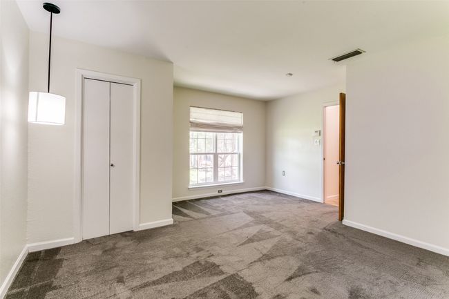 Primary bedroom has his and her closets. | Image 15