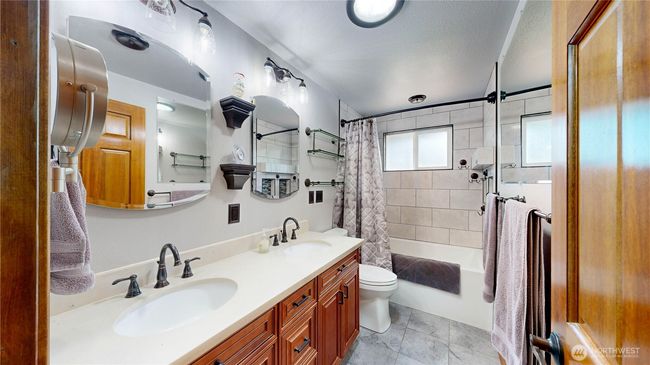 Remodeled Primary Bath in 2020 includes a double vanity, tiled shower, and flooring | Image 8
