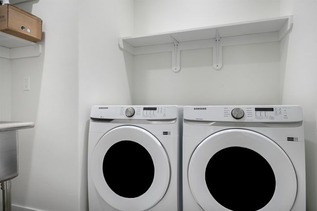 Laundry room with washer and clothes dryer with sink | Image 29