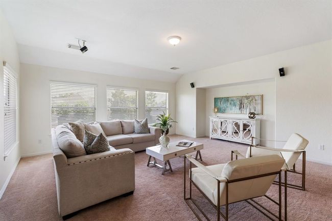 The spacious upstairs game room offers versatile space for lounging, play, or a home office. | Image 22