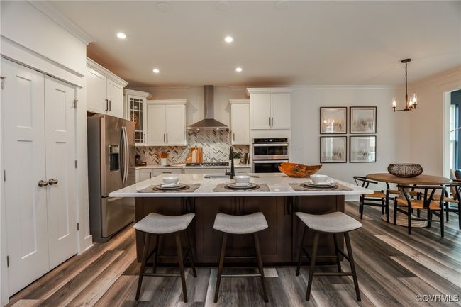 VIRTUAL STAGING. Photo represents the plan with virtual staging. Kitchen with island and pantry. | Image 4