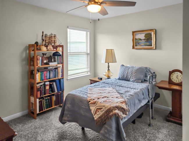 Bedroom 1 with carpet flooring and a ceiling fan | Image 21