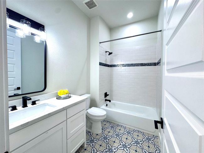 Bathroom featuring vanity, shower combination, and tile patterned flooring | Image 26
