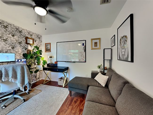 Office space featuring wood finished floors, ceiling fan, and wallpapered walls | Image 10