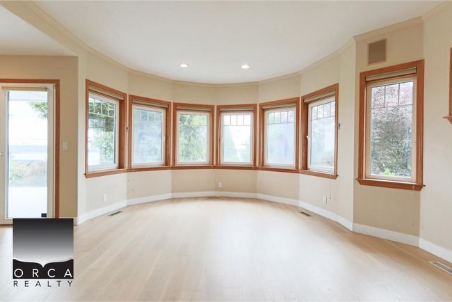 Unfurnished room with healthy amount of natural light, light wood-style flooring, and recessed lighting | Image 12