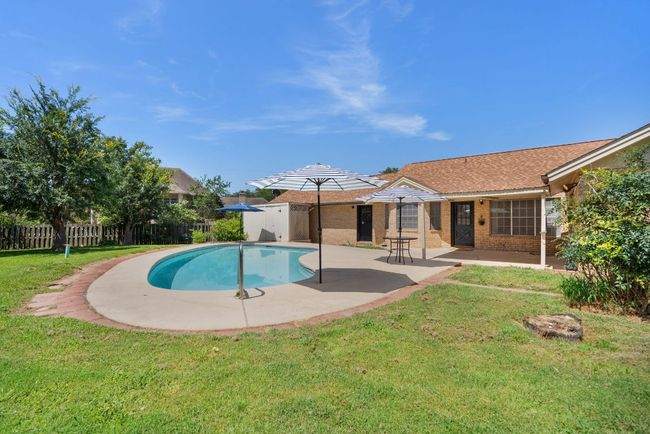 View of swimming pool featuring a patio area | Image 30
