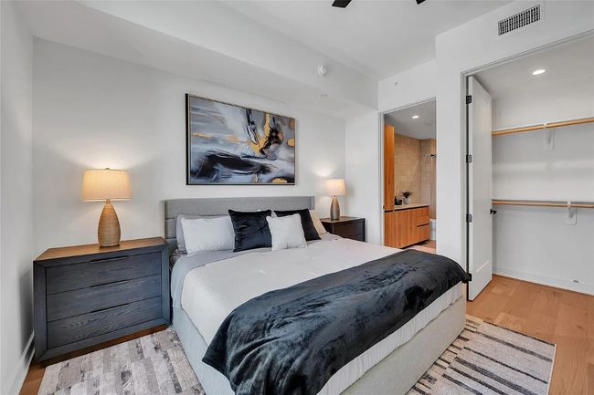 Bedroom featuring light wood finished floors, recessed lighting, and ensuite bath | Image 10