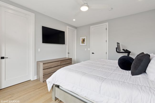 Walk-in closet is on the left and the bathroom is | Image 11