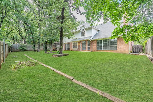 Back view of home & backyard. Lawn has been digitally enhanced. | Image 40