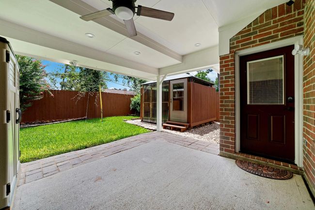 A beautifully covered backyard patio designed to enhance outdoor living, providing a comfortable and elegant space for relaxation, entertaining, and enjoying leisurely activities year-round. | Image 30