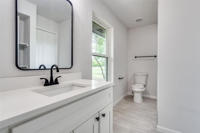 Bathroom with vanity and wood tiled floors | Image 22