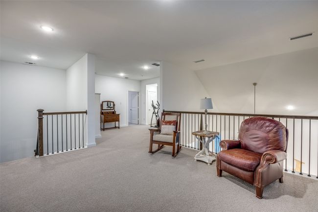 Sitting room with visible vents, an upstairs landing, and light carpet | Image 20