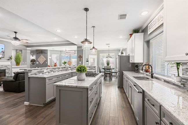 Views overlooking the backyard and pool area will not disappoint. | Image 19
