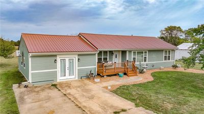 View of front of property with covered porch and a front yard | Image 2