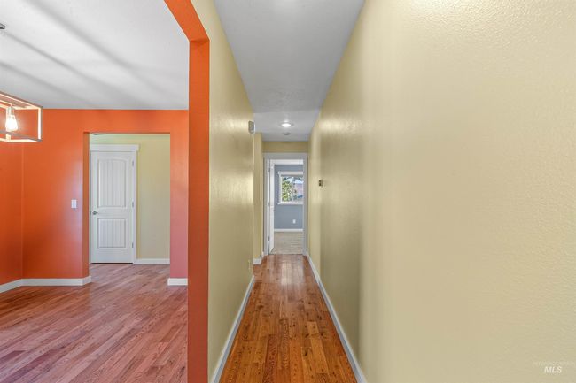 Hall with wood finished floors and baseboards | Image 16