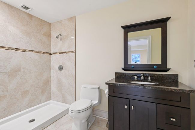 Full bath with a tile shower and vanity | Image 36