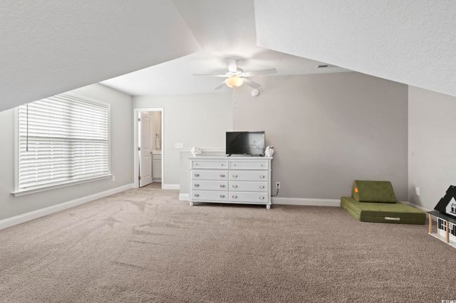 Carpeted bedroom featuring baseboards and ceiling fan | Image 32