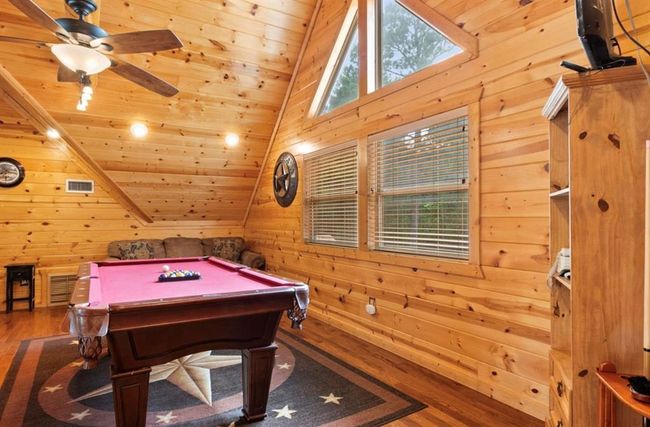 Game room with wood ceiling, wood finished floors, wood walls, vaulted ceiling, and billiards table | Image 27